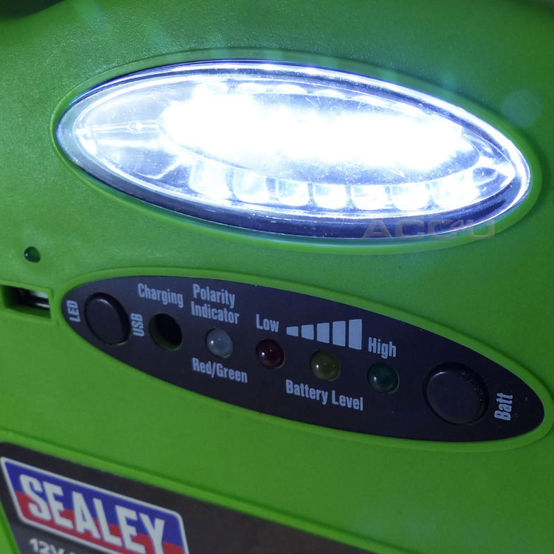 a close up of a green clock on a green surface 