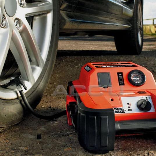 a red car with a toy car sitting on the ground 