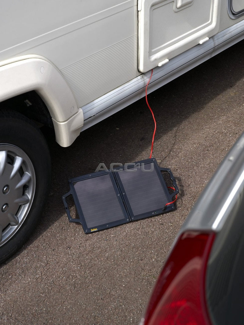 a car is parked next to a suitcase 